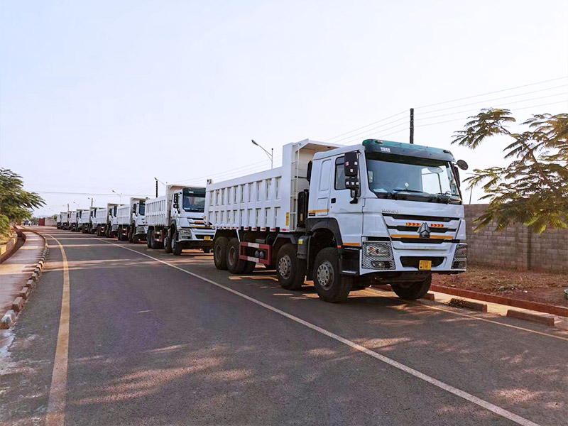 SINOTRUK distributor REBA INDUSTRIAL CORPORATION LIMITED 8X4 tipper trucks are ready to be delivered to customer in mining area of Zambia，used for the transportation of copper mine.